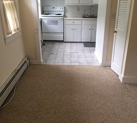 view to kitchen refrigerator not shown is full size