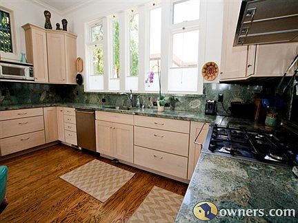 stunning granite counters, lots of cupboardss