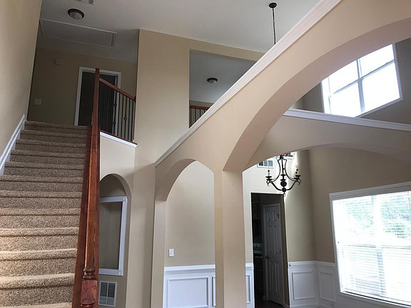 2 story living and dining room area