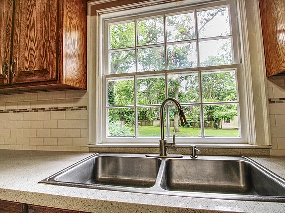 Kitchen overlooks backyard