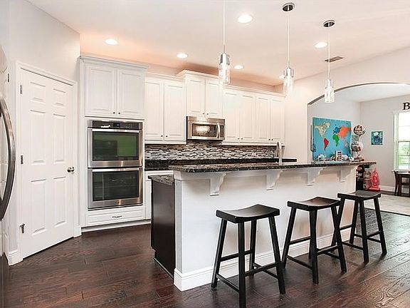 Beautiful gourmet kitchen with granite counters & glass tile back-splash. Flex room is conveniently located off the kitchen.