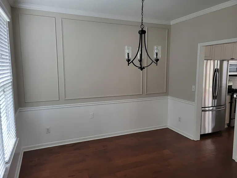 This is what I would consider the dining room. To the right it leads to the Kitchen. The left window is to the front lawn. As you walk into the front door this will be to your immediate left. It is much bigger than the picture shows.