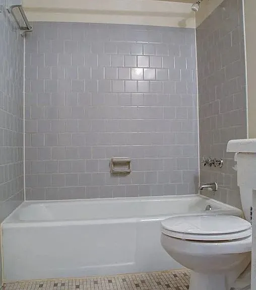 Tiled floor bathroom with subway tiled shower