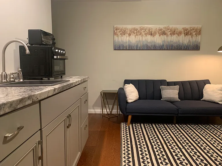 Private guest suite with kitchenette and living area.