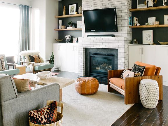 Custom tile work on gas fireplace. Furniture not included.