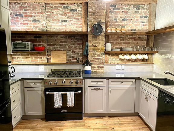 Fully stocked kitchen with gas range and dishwasher