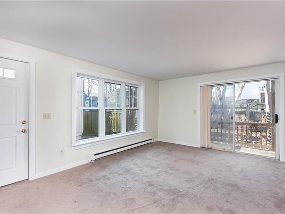 Living room w/ back deck in view.