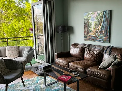 Living Room with sliding window/doors open to deck.