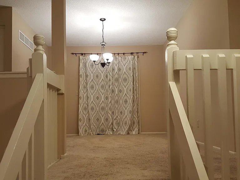 Formal dining room right off of the kitchen with patio doors out to deck