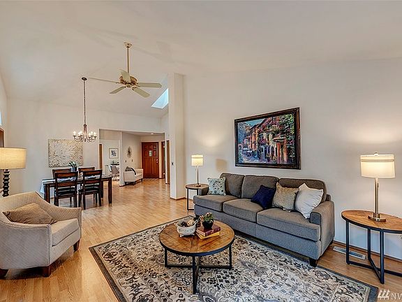 Imagine entertaining in this beautiful space. That is the front door and entry to the kitchen in the background.