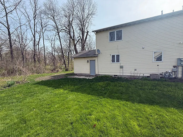Backyard of unit - backing up to walking trail