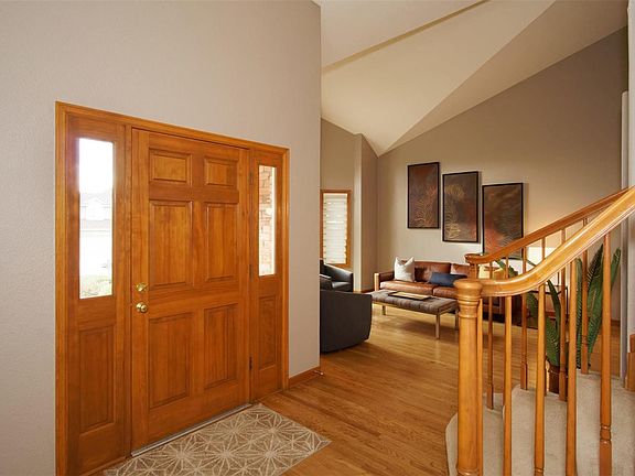 Vaulted entry way and living room