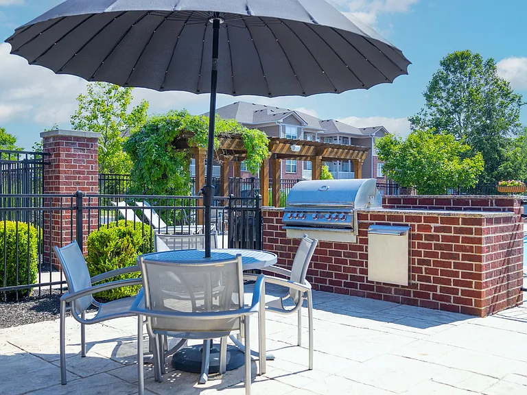 Grilling Station with Shaded Umbrella Seating at Westhaven Luxury Apartments