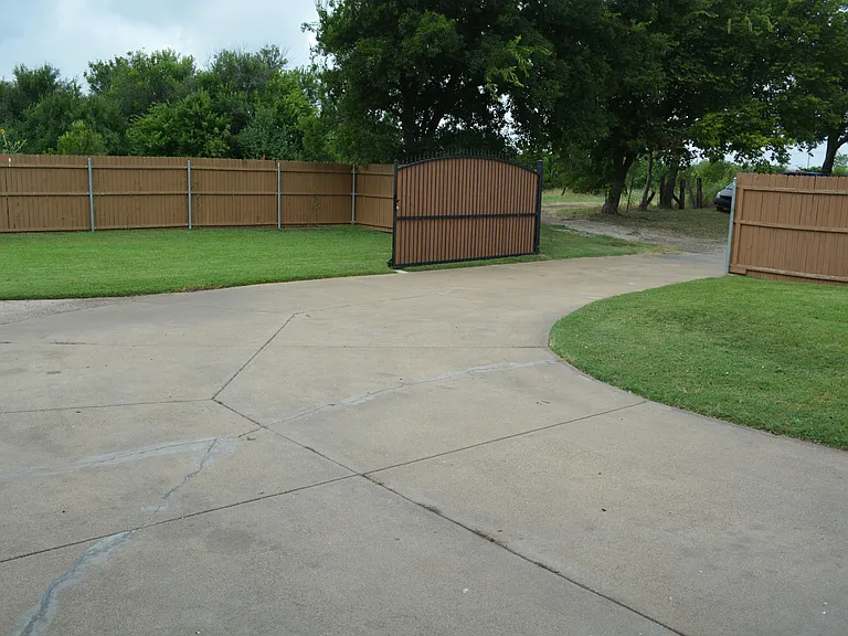 Enjoy our large driveway to fit multiple cars with-in the gated area.