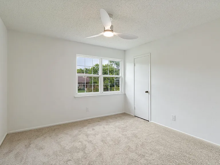 Bedroom 1 with a spacious closet.