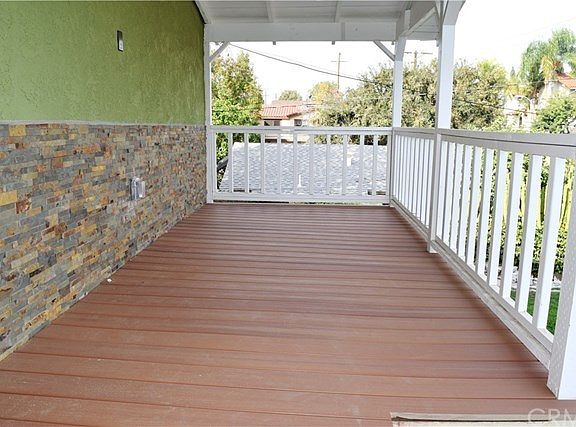 Front house. New deck on front porch.
