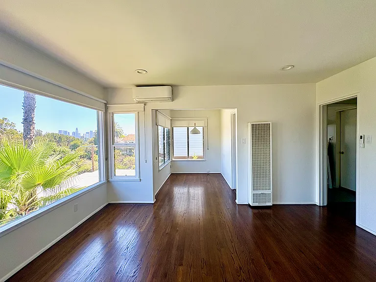 Split-system air conditioning with heating, plus a separate wall heater.