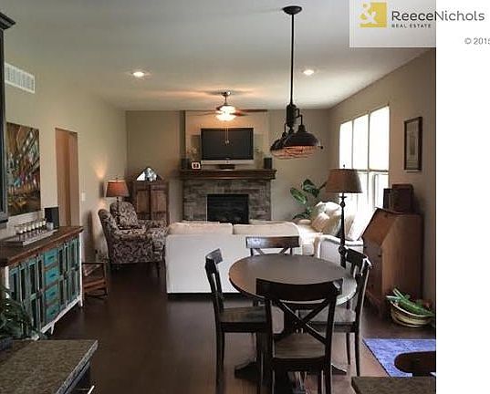 Great Room opens to Dining + Kitchen. Tons of windows & slider t