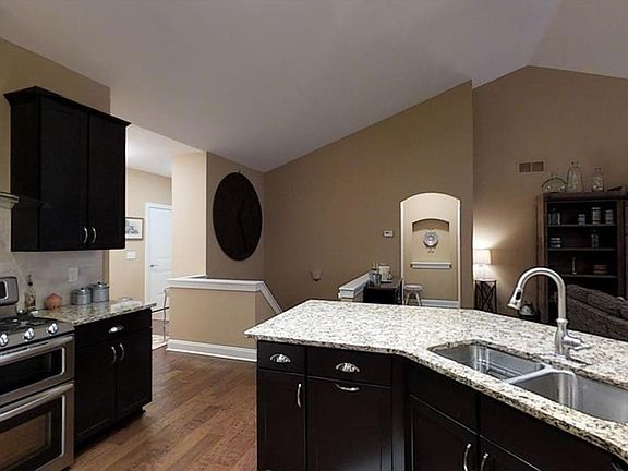 Kitchen island and open stairs to basement