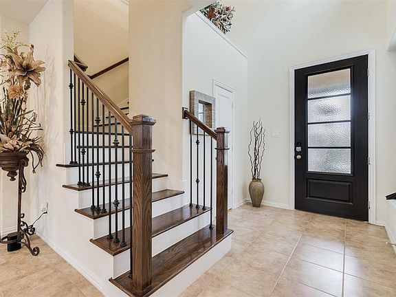 This attractive and upscale Iron Stair Balusters also add to the over Upscale and Stylish Ambiance of this well designed Cozy and Welcoming Floor Plan Design.