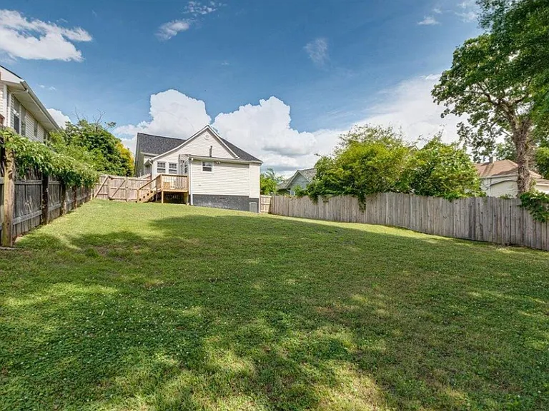 Fenced Back Yard from back of yard looking towards the house