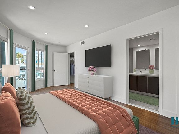 Bedroom with Walk-In Closet with Built-In Organizers, and Bathroom