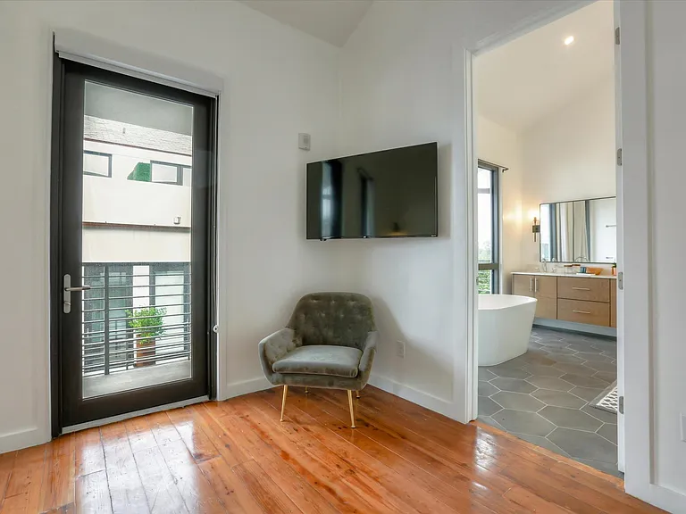 The master bedroom and bathroom have over 12ft ceilings and lots of natural light.