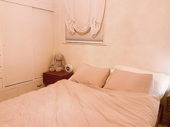 Bedroom for Queensize bed + 2 night stands. blind-out shades and cedar wardrobe.