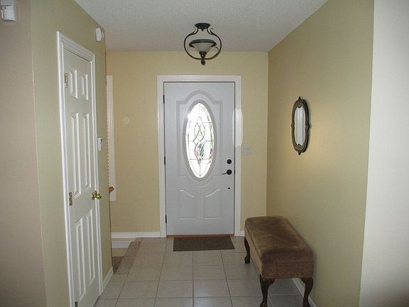 Welcoming entryway with coat closet.