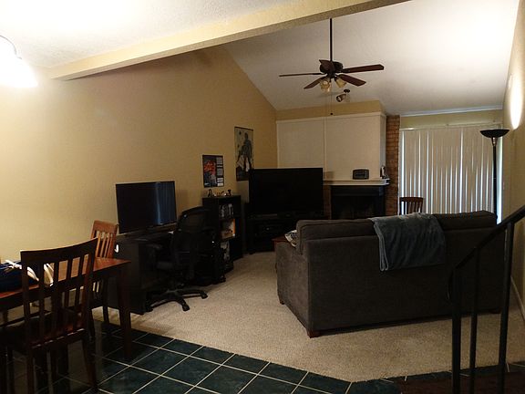 Large living with vaulted ceiling and wood burning fireplace