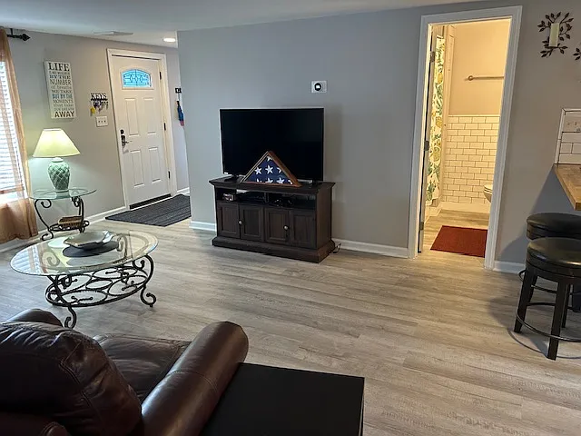 View of front door entrance with Nook and access to laundry room and utility closet