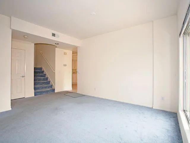 staircase up in the corner of living/family room