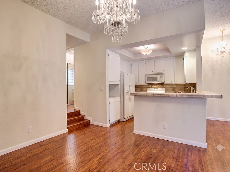 Kitchen, dining room. Chandelier has been replaced. This picture is from previous listing.