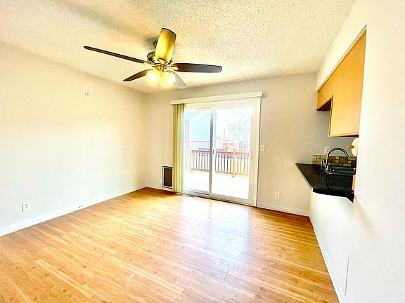 The dining room has space for seating a table of six. The kitchen's granite counter tops extend to make a breakfast bar for easy socializing with the chef. Step out into your backyard deck for a breath of fresh air.