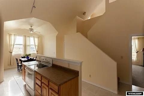 Kitchen and dining area, stairway to loft.
