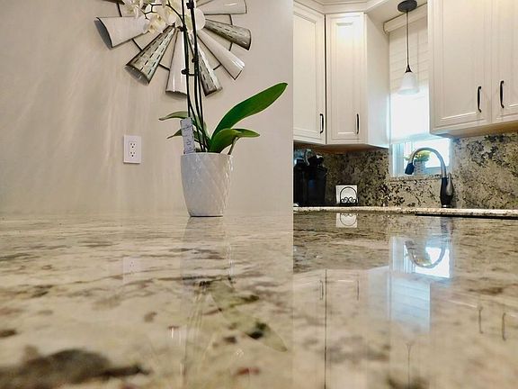 Island in kitchen with granite
