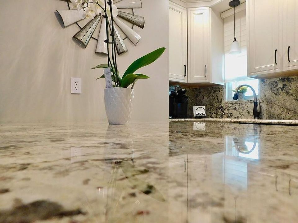 Island in kitchen with granite