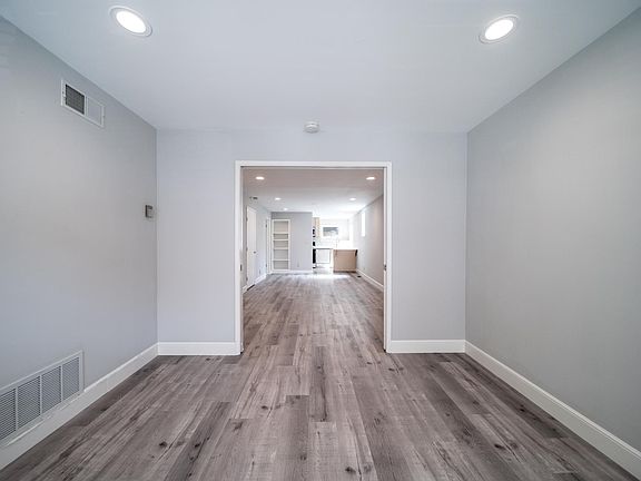 View from bedroom to living space beyond pocket doors