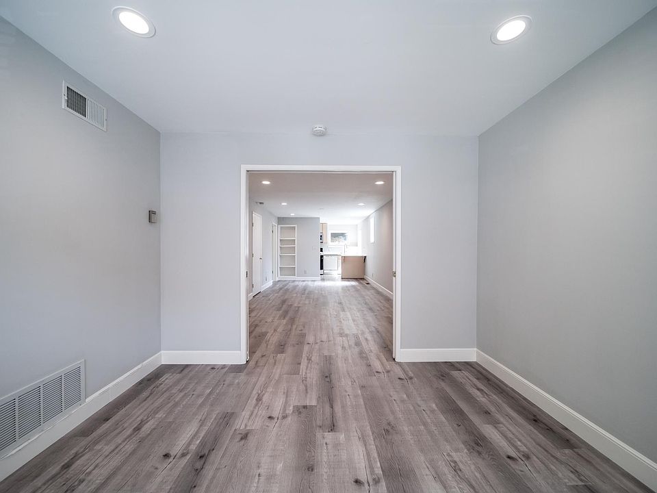 View from bedroom to living space beyond pocket doors