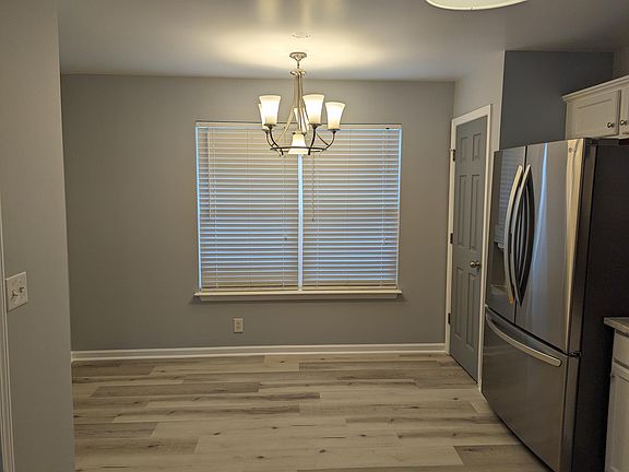 Plenty of space for dining inside your brand new kitchen! Note the beautiful new lighting!