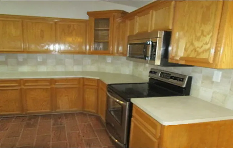 Kitchen includes stainless appliances and lots of storage including a pantry.