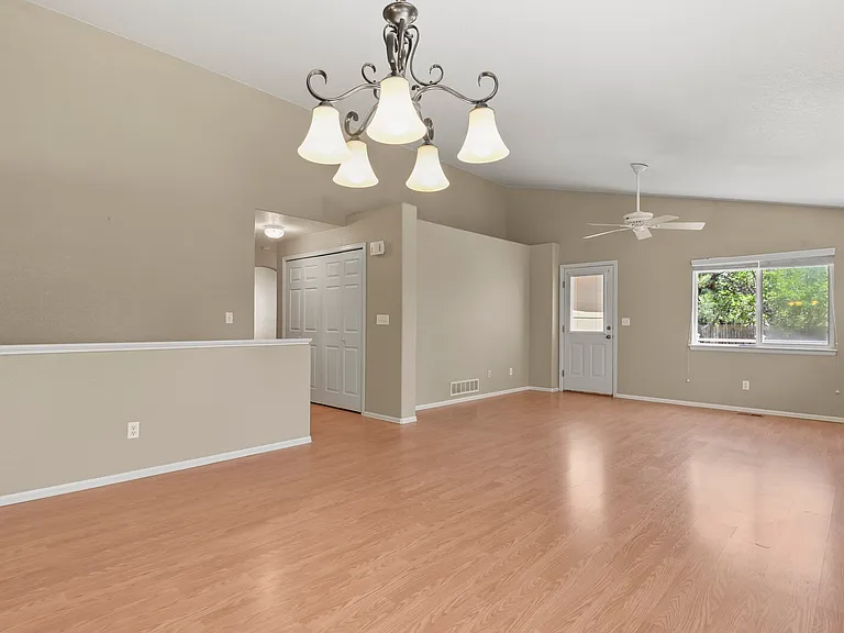 Dining and Living Room with door leading on to the back deck