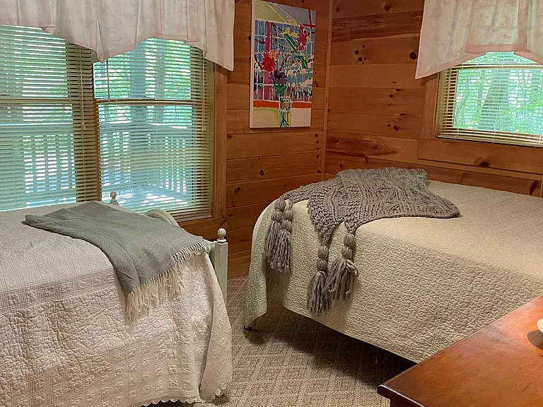 downstairs guestroom with single and double bed,