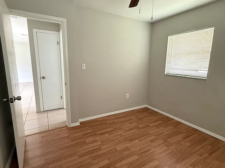 Bedroom on right, back side of house. Just outside of the bedroom door to the right is the bathroom and in the picture is the linen closet door.