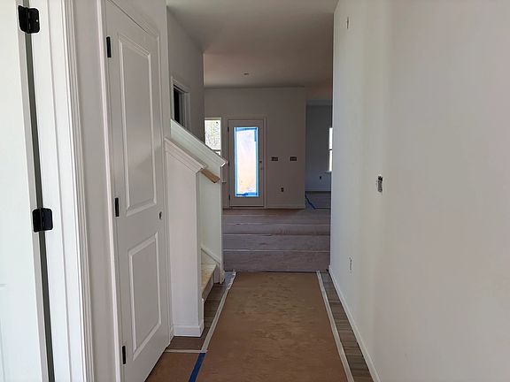 Foyer featuring the AW Collection R Rosemary - Natural light and bold color create grounded warmth.