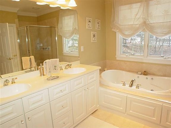 master bath with shower and jacuzzi
