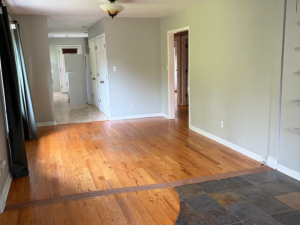 Entry way into large light-filled living area.