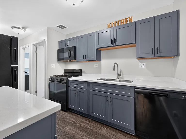 Cook up something great in this stylish kitchen with black appliances and cabinetry at Renaissance at Carol Stream in Carol Stream, IL.
