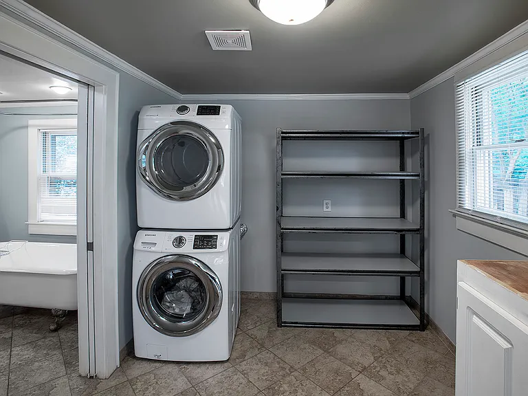 Laundry room + large pantry. 

Can be accessed through barndoor (current view) or pocket door next to master bath.