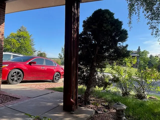 View from the front entrance area to the driveway (two car driveway with another spot in front of the house).